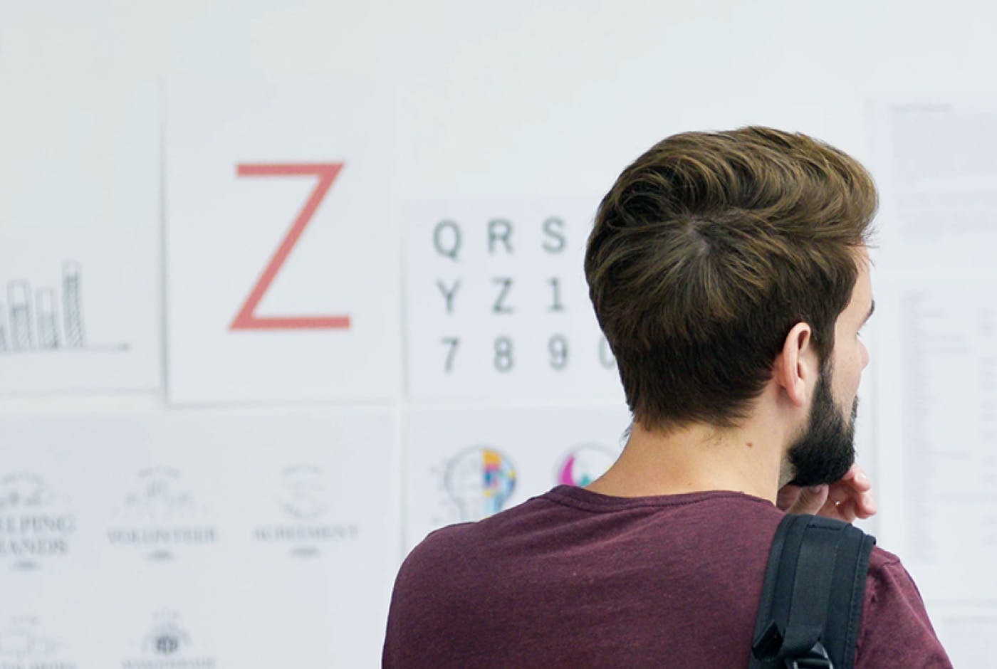 Header image of a person looking at a whiteboard